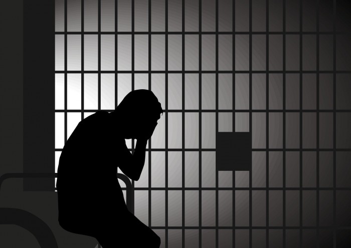 Vector illustration of a man in jail